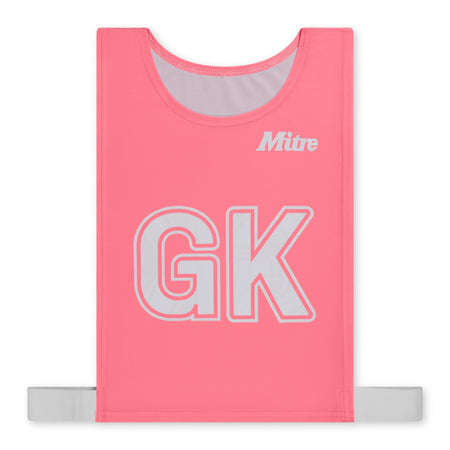 The Mitre Pro Netball Bib set features pink polyester micro mesh with white trim, large white GK letters, the Mitre logo on the top right, and a horizontal white strap at the bottom. Adult size. Brand: Mitre. Color: Pink.