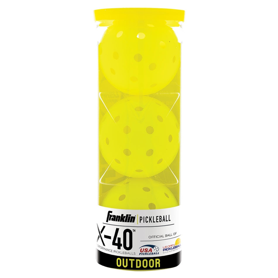A cylindrical container holds three yellow Franklin Outdoor X-40 Pickleballs with holes. The label shows the Franklin brand and highlights official USA Pickleball approval and endorsement for these outdoor pickleballs.