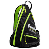 The Franklin Pickleball Sling Bag by Franklin features a Black/Optic color, multiple compartments, mesh side pocket, honeycomb pattern, neon green zippers, and a white logo—a stylish and functional gear bag inspired by the US Open official bag.