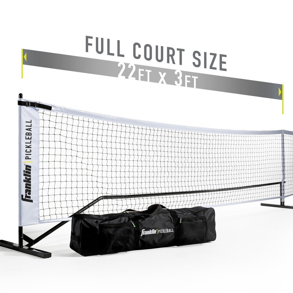 The Franklin Pickleball Official Net, a portable and official size net (22 ft x 3 ft), is displayed with a black carrying bag featuring the Franklin logo. Text above reads: FULL COURT SIZE 22 FT X 3 FT.