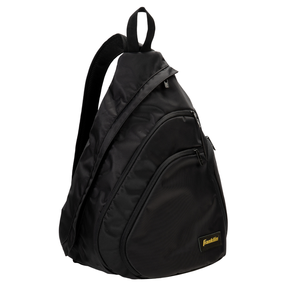 The Franklin Elite Pickleball Sling Bag by Franklin features a black teardrop shape, single shoulder strap, zippered compartments, and a gold label—perfect as your go-to pickleball gear bag.