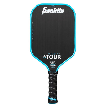 The Franklin FS Tour Dynasty Pickleball Paddle by Franklin in blue features a textured grip, premium carbon fiber face, is USA Pickleball approved, and offers enhanced performance.