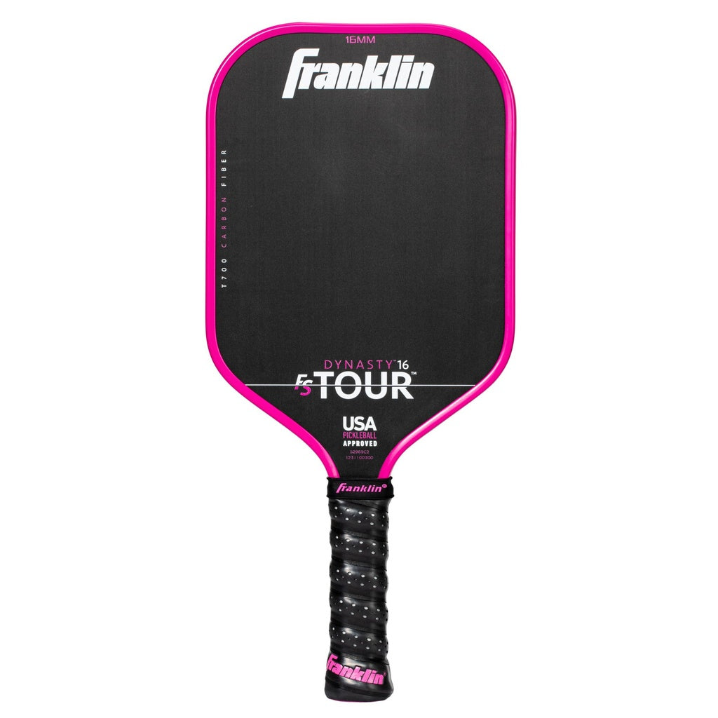 The Franklin FS Tour Dynasty Pickleball Paddle features a black carbon fiber face with pink trim, a black grip with pink end cap, "Franklin" at the top, is USA Pickleball approved, and displays "DYNASTY 16 TOUR" on the face. Color: Pink.