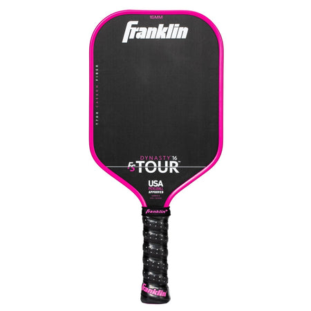 The Franklin FS Tour Dynasty Pickleball Paddle features a black carbon fiber face with pink trim, a black grip with pink end cap, "Franklin" at the top, is USA Pickleball approved, and displays "DYNASTY 16 TOUR" on the face. Color: Pink.