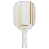 The Franklin Signature Pro Series Pickleball Paddle by Franklin features a gold design, USA Pickleball Approved text, white grip tape on the handle, and MaxGrit surface technology for enhanced spin.