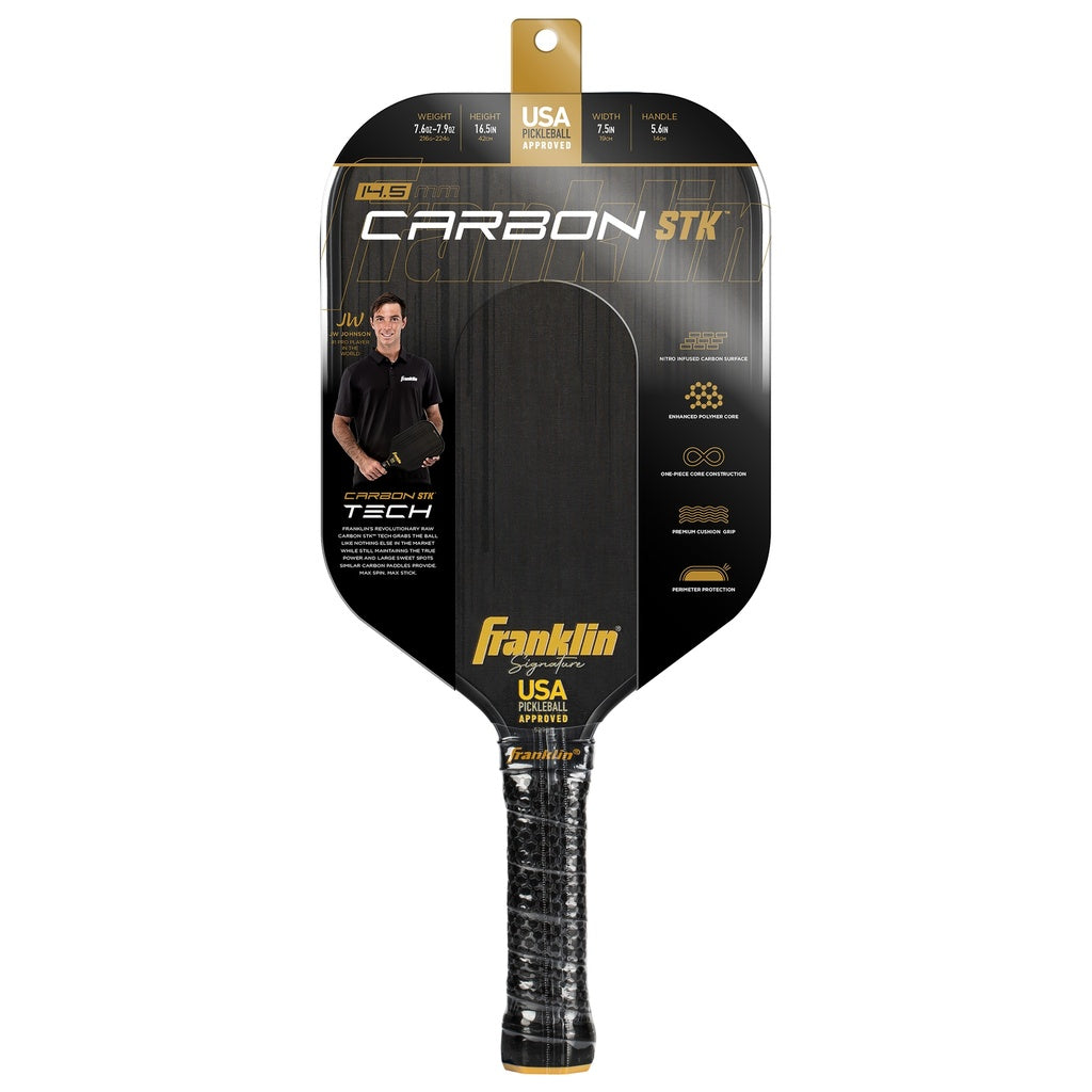 The Franklin Carbon STK Pickleball Paddle by Franklin comes in black packaging with a photo of a man holding the USAPA-approved paddle. Packaging highlights carbon fiber technology and key features.