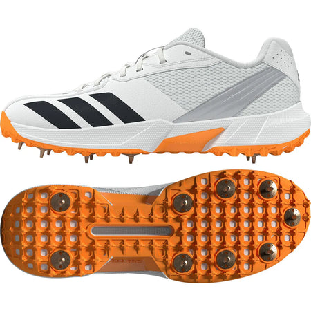 Adidas 22YDS White/Orange Cricket Spikes 2026 feature Cloud White with black stripes and Lucid Tangerine spikes, shown from the side and bottom to display grip and metal spikes—ideal for top cricket performance.