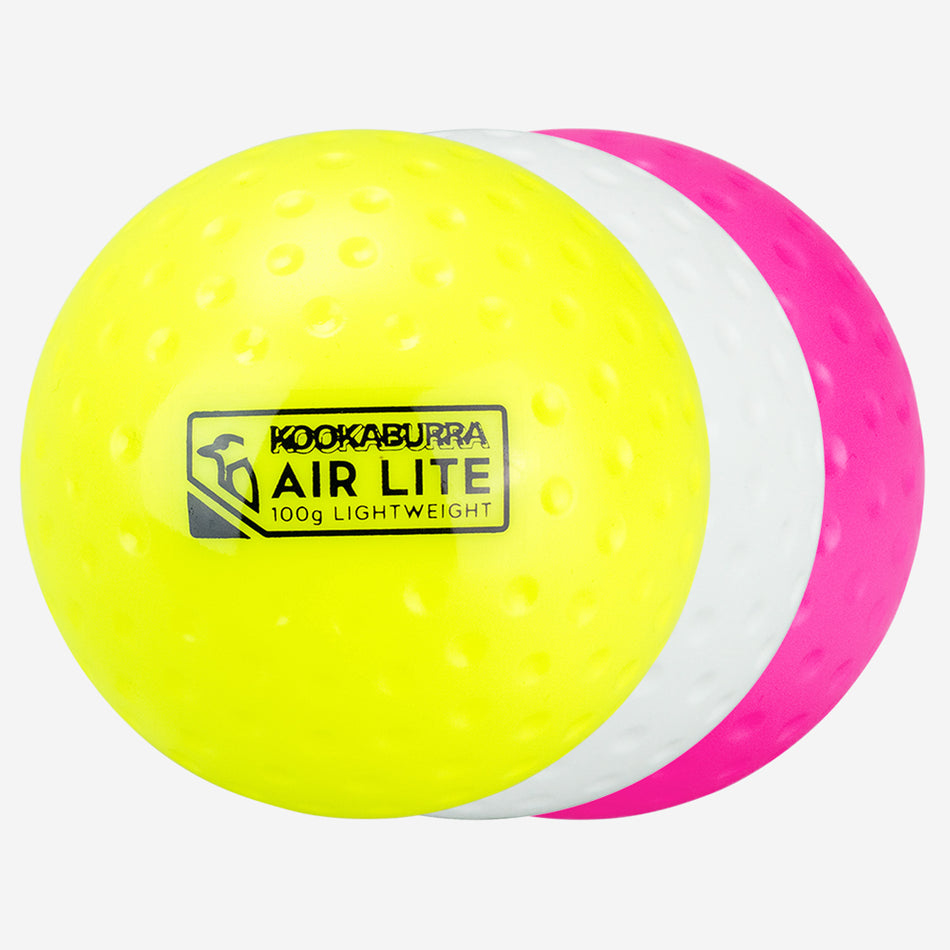 The Kookaburra Air Lite Dimple Hockey Ball White, by Kookaburra, features a dimpled design with yellow, white, and pink sections—ideal as a lightweight training aid.