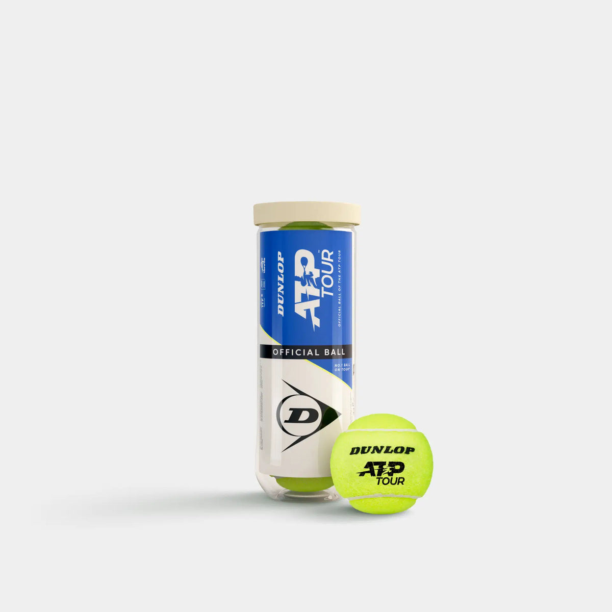 A Dunlop ATP Tour (3 Ball Tube) stands upright, featuring blue and white branding. In front, a yellow Dunlop tennis ball rests against a plain white background, emphasizing professional tour-level performance.