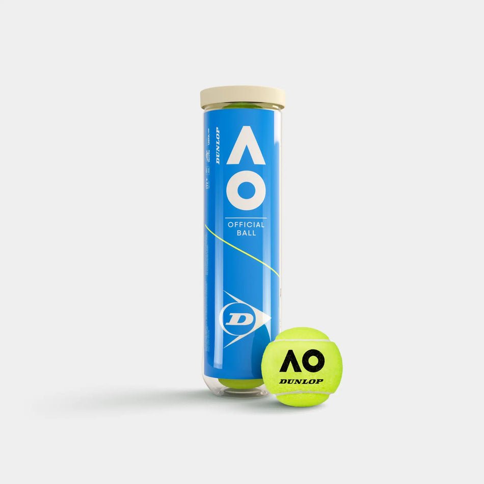 A tube of Dunlop Australian Open Tennis Balls (4 Ball Tube) stands upright beside a yellow ball with AO and Dunlop logos, showcasing Grand Slam performance against a plain light background.