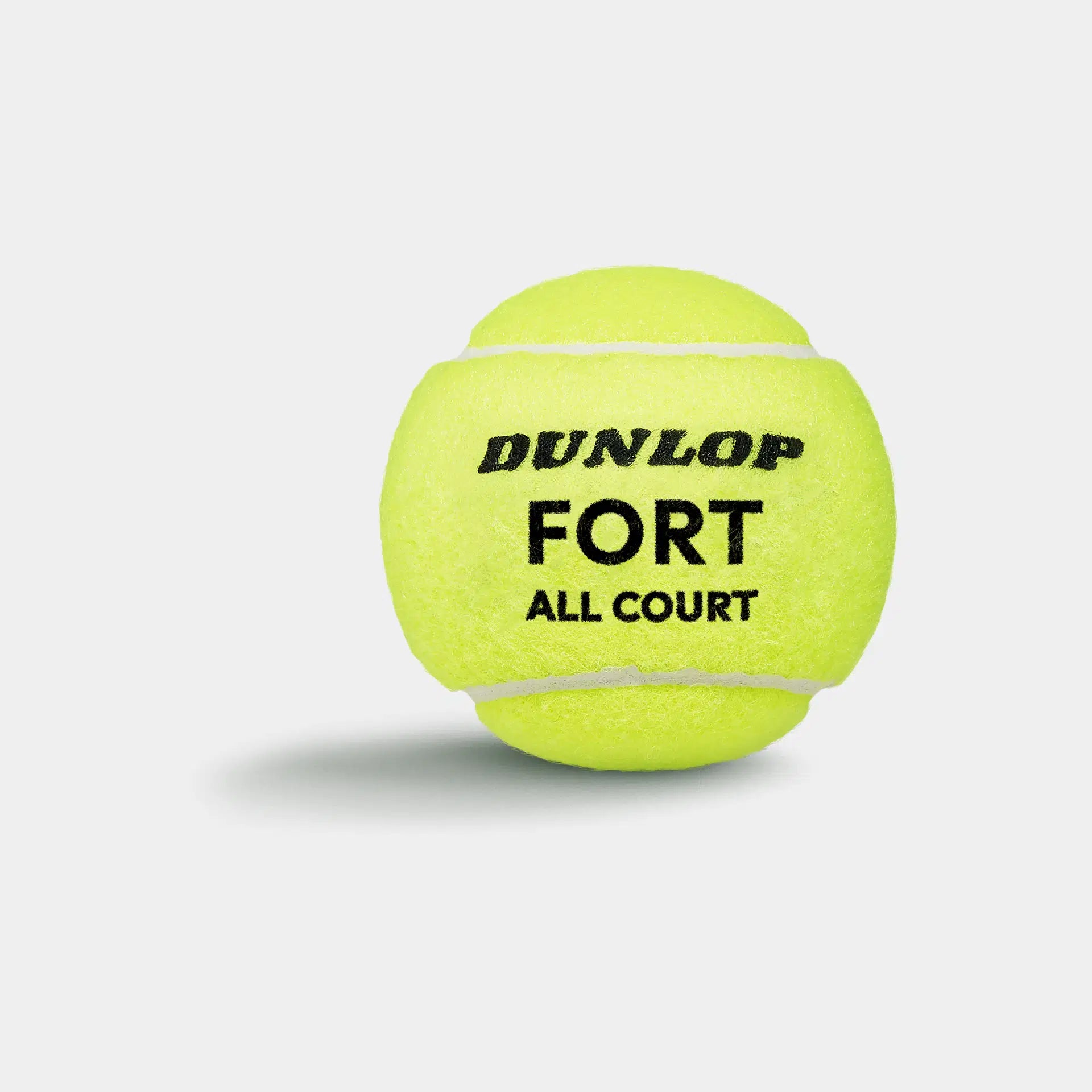 A bright yellow Dunlop Fort All Court Tennis Ball (4 Ball Tube) is shown on a white background with a soft shadow beneath. The Dunlop brand and model are printed in bold black text, highlighting its elite-level performance.