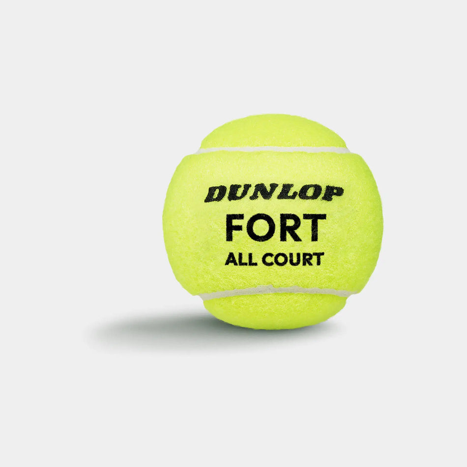 A bright yellow Dunlop Fort All Court Tennis Ball (4 Ball Tube) is shown on a white background with a soft shadow beneath. The Dunlop brand and model are printed in bold black text, highlighting its elite-level performance.