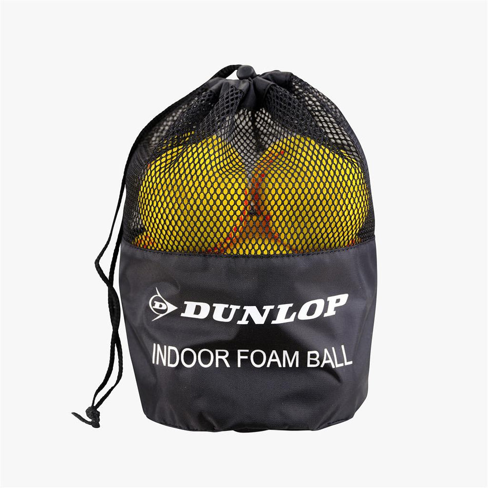 A black mesh drawstring bag labeled Dunlop holds 12 yellow Indoor Foam Tennis Balls by Dunlop, partially visible through the mesh.