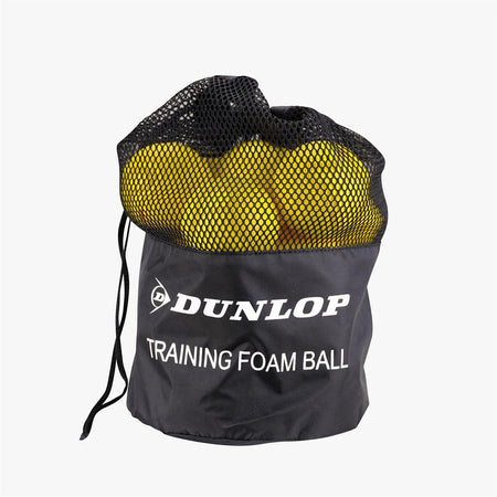 A black mesh drawstring bag labeled "Dunlop" holds 12 bright yellow Dunlop Training Foam Tennis Balls, perfect for kids’ tennis and easily visible through the mesh.