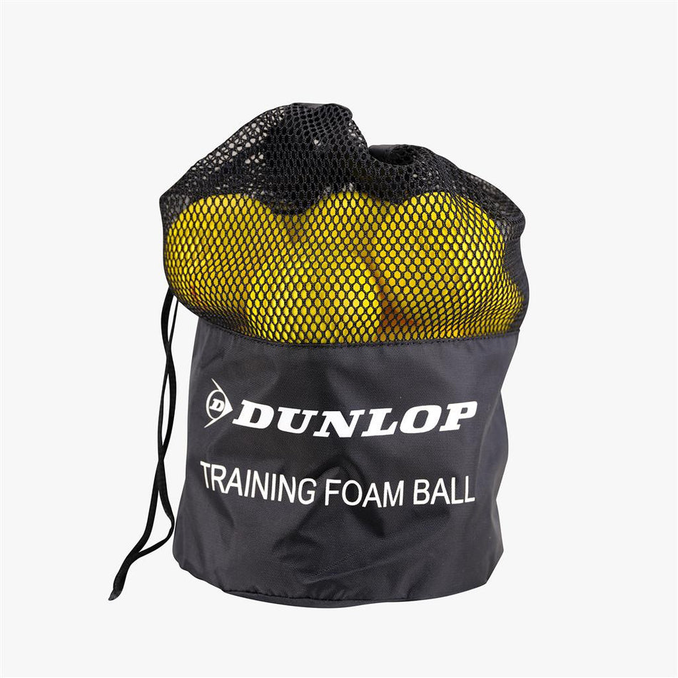 A black mesh drawstring bag labeled "Dunlop" holds 12 bright yellow Dunlop Training Foam Tennis Balls, perfect for kids’ tennis and easily visible through the mesh.