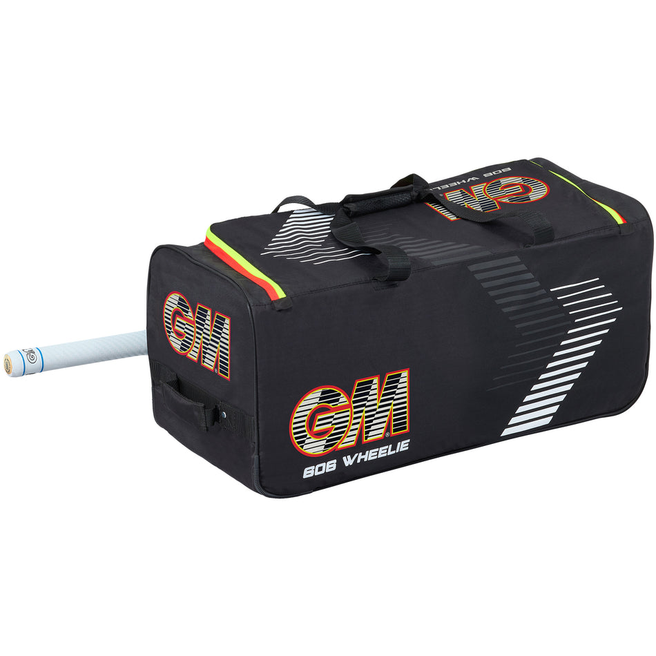 The Gunn & Moore 606 Wheelie 2026 is a spacious black cricket bag with white and orange accents, sturdy handles, wheels for easy transport, and a bat sleeve with a cricket bat partially visible at one end.