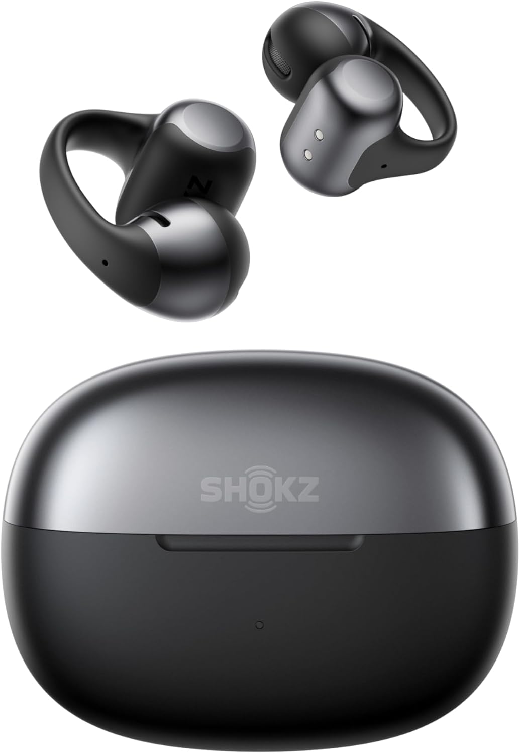 A pair of black Shokz OpenDots One wireless earbuds with ear hooks hovers above a matching black charging case labeled Shokz.
