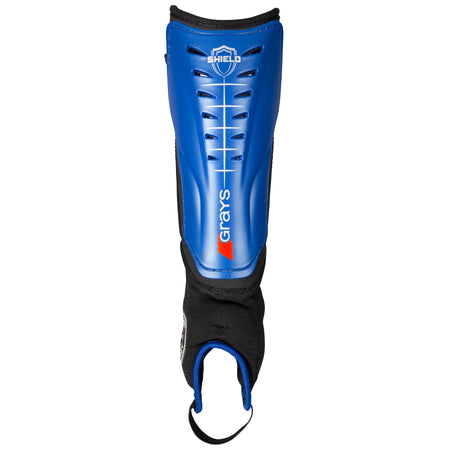 The Grays Shield Shinguard in blue features a protective plastic shell, shock-absorbing black fabric padding, ankle protection, ventilation slots, and a bottom hook-and-loop elastic strap.
