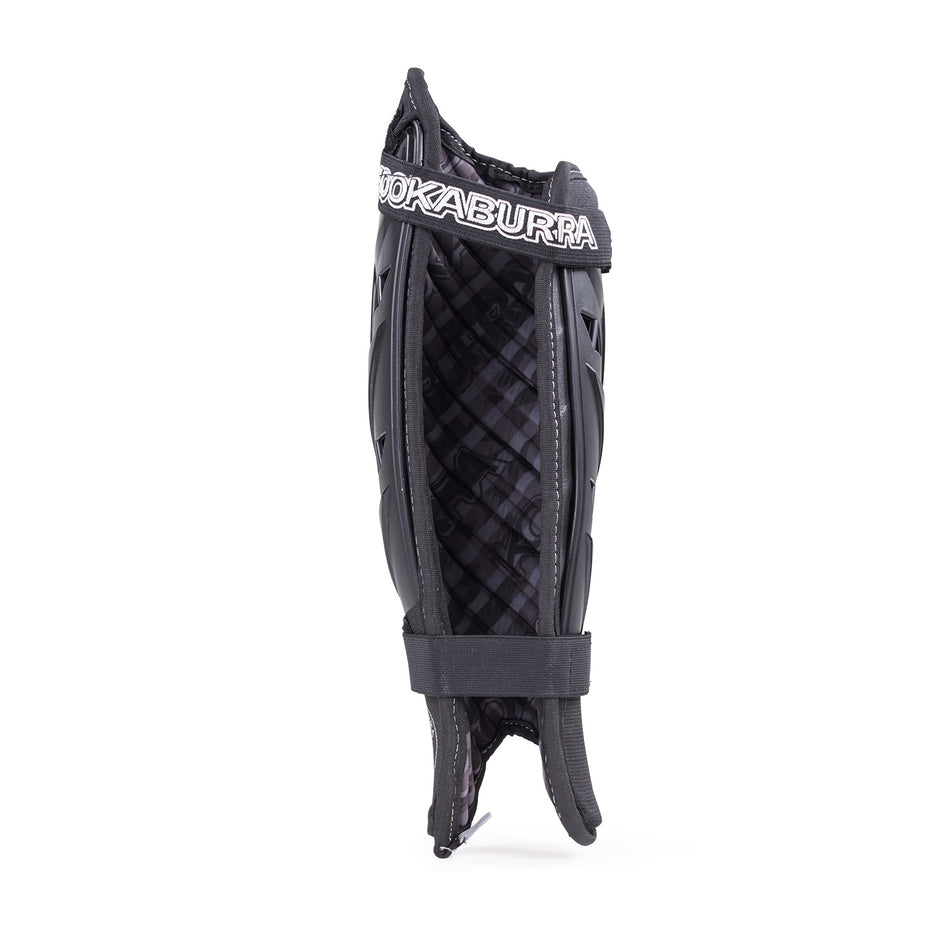 The Kookaburra Pro Spirit Shinguards by Kookaburra are black leg guards featuring quilted inner padding, a foam backing for comfort, and two adjustable straps for a secure fit.
