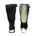 The Kookaburra Octane Shinguards in Black/Lime feature elastic foot loops, a clear plastic front with brand logo, and added ankle disc protection for junior players.