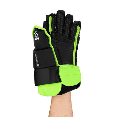 A person wears the Kookaburra Pro Conflict Hockey Glove by Kookaburra—black and neon green, padded with high density foam, rubberised palm for grip, and extra wrist/finger protection—on a white background.