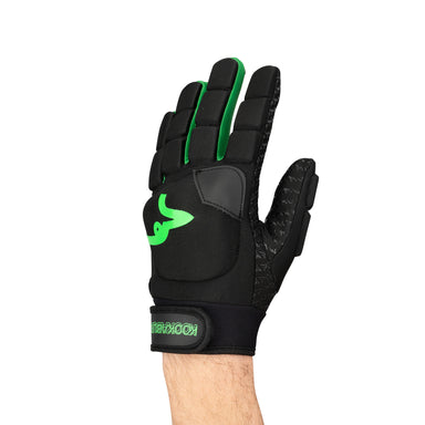A hand wears the Kookaburra Clone LH Hockey Glove, a lightweight, stretchable glove with green accents and logo, striped fingers, Velcro strap labeled Kookaburra, and a rubberised palm grip for control.
