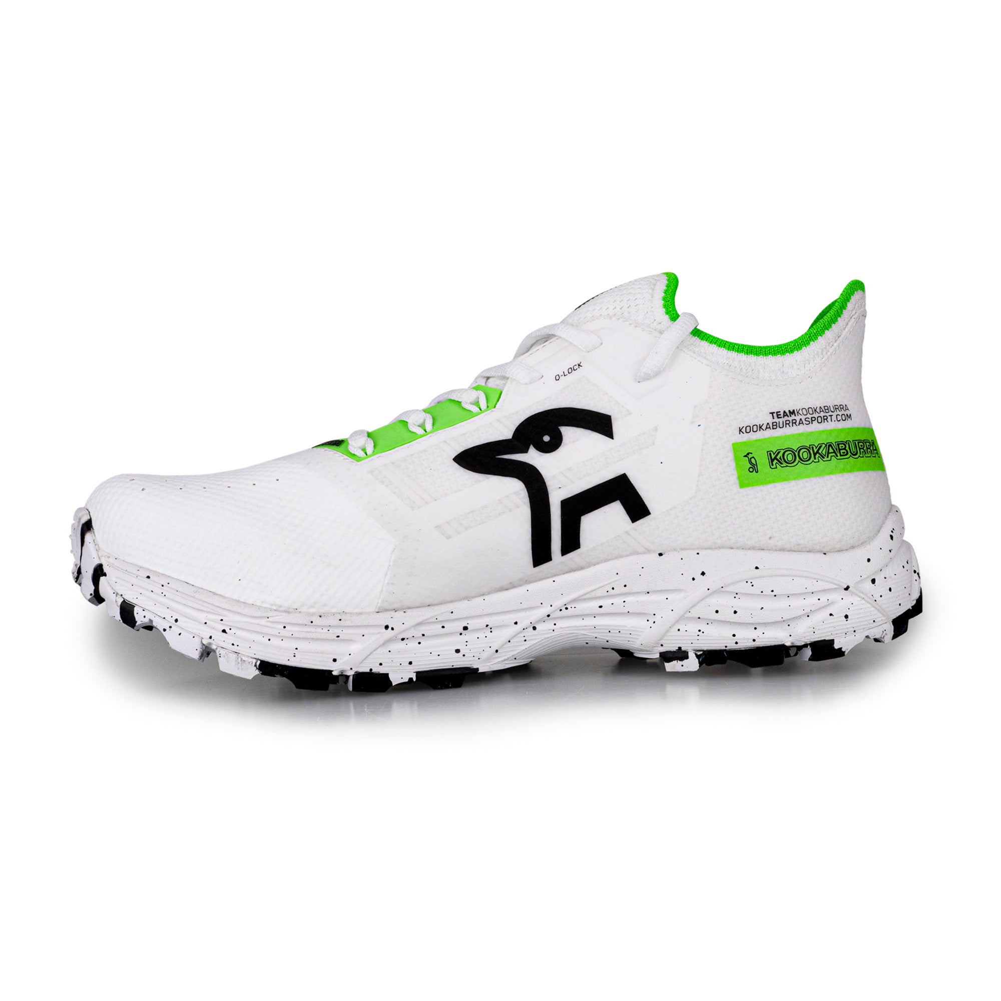 The Kookaburra Vapor Hockey Shoes by Kookaburra are white athletic shoes with green accents, a black bird logo, black speckled sole, Q Lock lacing system, green text and trim on the heel, and white laces with green eyelets.