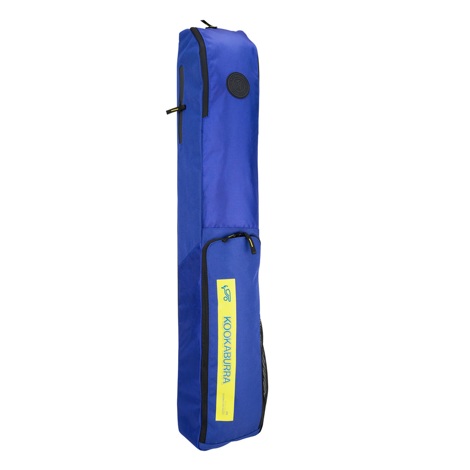 A blue Kookaburra Vex Hockey Kitbag 2025 with zippered compartments, padded strap, large top pocket, and handle stands upright against a white background.