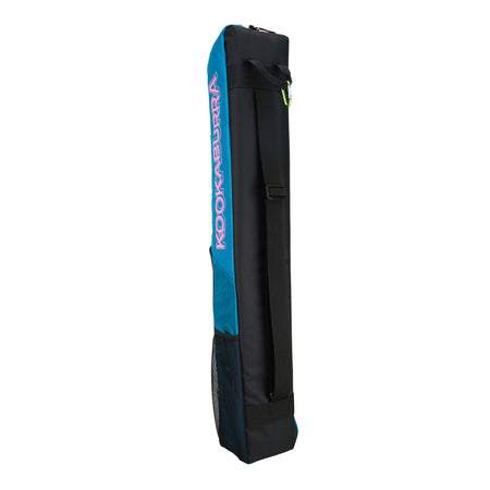 The Kookaburra Vex Hockey Kitbag 2025 is a rectangular black and teal bag with "Kookaburra" in pink and white, featuring a large top pocket, padded strap, and zipper closure.