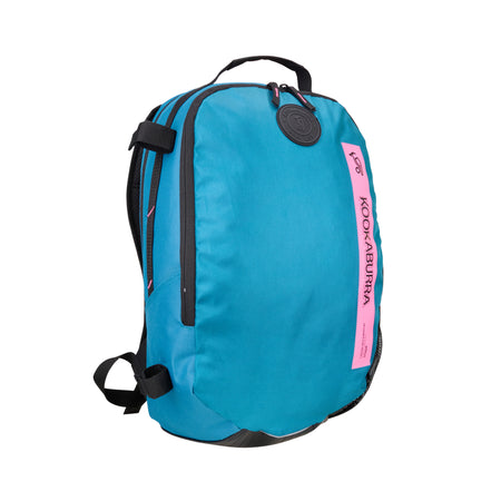 The Kookaburra Apollo Hockey Rucksack 2025 features a marine and pink design with black straps, zippers, a front pink label, a round black logo tag near the top, and adjustable shoulder straps for comfort.