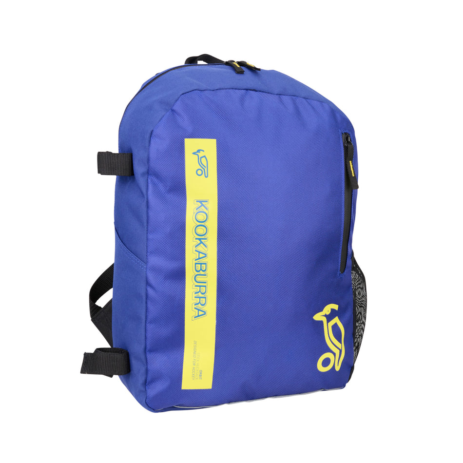 The Kookaburra Orbit Hockey Rucksack 2025 is a blue junior bag featuring black adjustable shoulder straps, a front zip pocket, and bold yellow Kookaburra branding with logo on the front.