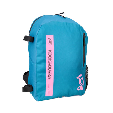 The Kookaburra Orbit Hockey Rucksack 2025 features a marine and pink design, black adjustable shoulder straps, a front zipper pocket, and a vertical stripe with the Kookaburra logo and brand name on the front.