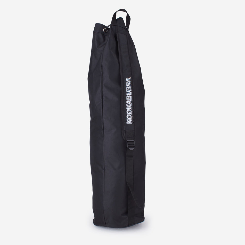 The Kookaburra Hockey Stick Duffel Bag is a large black bag with a single shoulder strap and KOOKABURRA printed vertically in white on the side, shown standing upright against a plain white background.