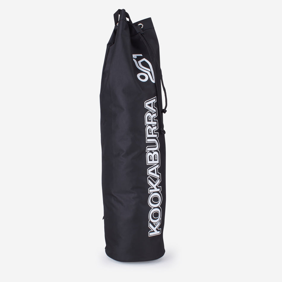 The Kookaburra Hockey Stick Duffel Bag is a tall, cylindrical black bag with a drawstring top. It displays the Kookaburra logo and KOOKABURRA in white on the side—ideal for teams to carry hockey sticks.