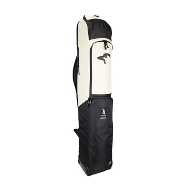 The Kookaburra Forge Hockey Bag 2026 by Kookaburra is a tall, rectangular bag with a cream upper and black lower section, zippered compartments, a bird logo on the cream part, and a sturdy base. The bag stands upright against a white background.