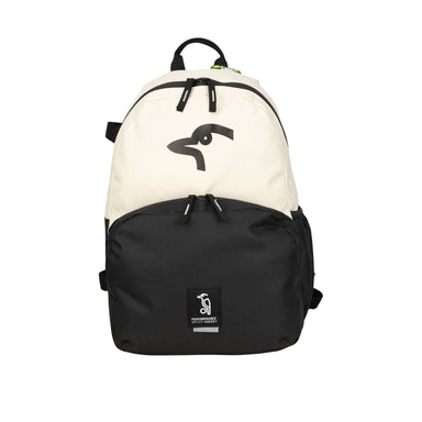 The Kookaburra Flow Rucksack 2026 by Kookaburra is a black and white functional backpack featuring adjustable straps, a large front pocket, a stylized penguin logo on top, and a small rectangular penguin patch on the lower pocket.