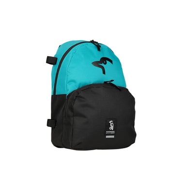 The Kookaburra Flow Rucksack 2026 features a turquoise top, black bottom, black logo on the upper front, rectangular patch on the lower pocket, and adjustable shoulder straps, all shown against a white background.