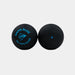 Two black Dunlop squash balls are shown on a light background: one is a beginner’s Dunlop Game Blue ball featuring the Game Blue logo and text, while the other has a single blue dot without visible text.