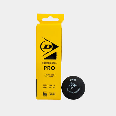 A yellow Dunlop Pro Squash Ball (4 x 3 Ball Box) stands upright beside a black Dunlop squash ball featuring the “Pro” label in white text, emphasizing its status as a low-bounce option preferred by advanced players.