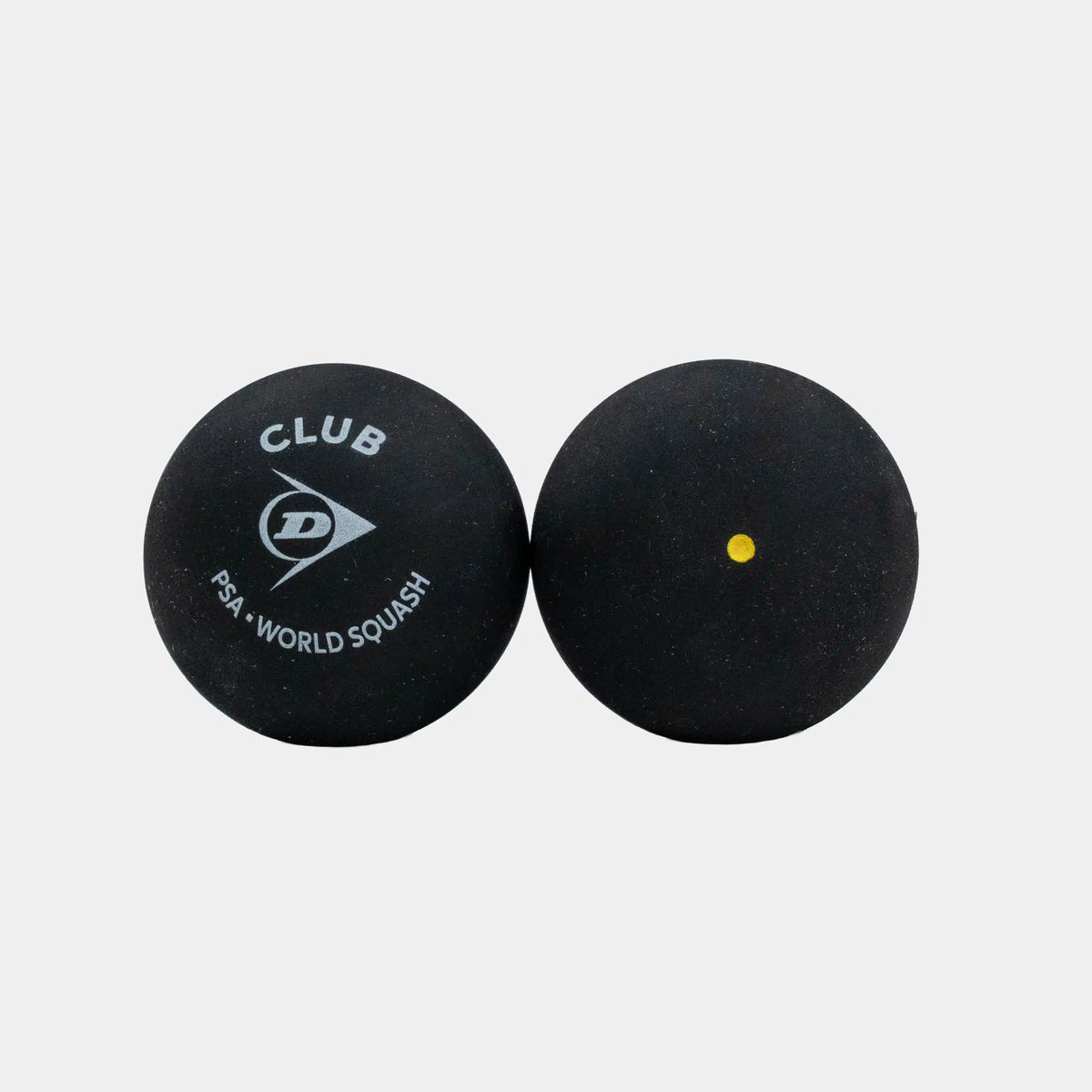 Set against a white background, two black Dunlop Club Squash Balls are shown—one with the Dunlop Club Squash Ball logo and PSA World Squash branding, the other featuring a single yellow dot. Perfect for club-level league matches, these balls deliver consistent bounce and reliable performance. Available as Dunlop Club Squash Ball (12 x 1 Ball Box).