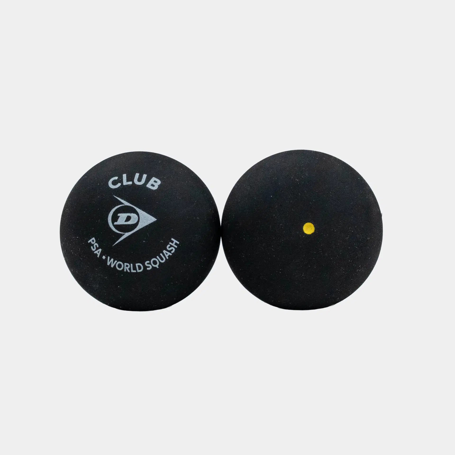 Set against a white background, two black Dunlop Club Squash Balls are shown—one with the Dunlop Club Squash Ball logo and PSA World Squash branding, the other featuring a single yellow dot. Perfect for club-level league matches, these balls deliver consistent bounce and reliable performance. Available as Dunlop Club Squash Ball (12 x 1 Ball Box).