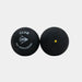 Set against a white background, two black Dunlop Club Squash Balls are shown—one with the Dunlop Club Squash Ball logo and PSA World Squash branding, the other featuring a single yellow dot. Perfect for club-level league matches, these balls deliver consistent bounce and reliable performance. Available as Dunlop Club Squash Ball (12 x 1 Ball Box).