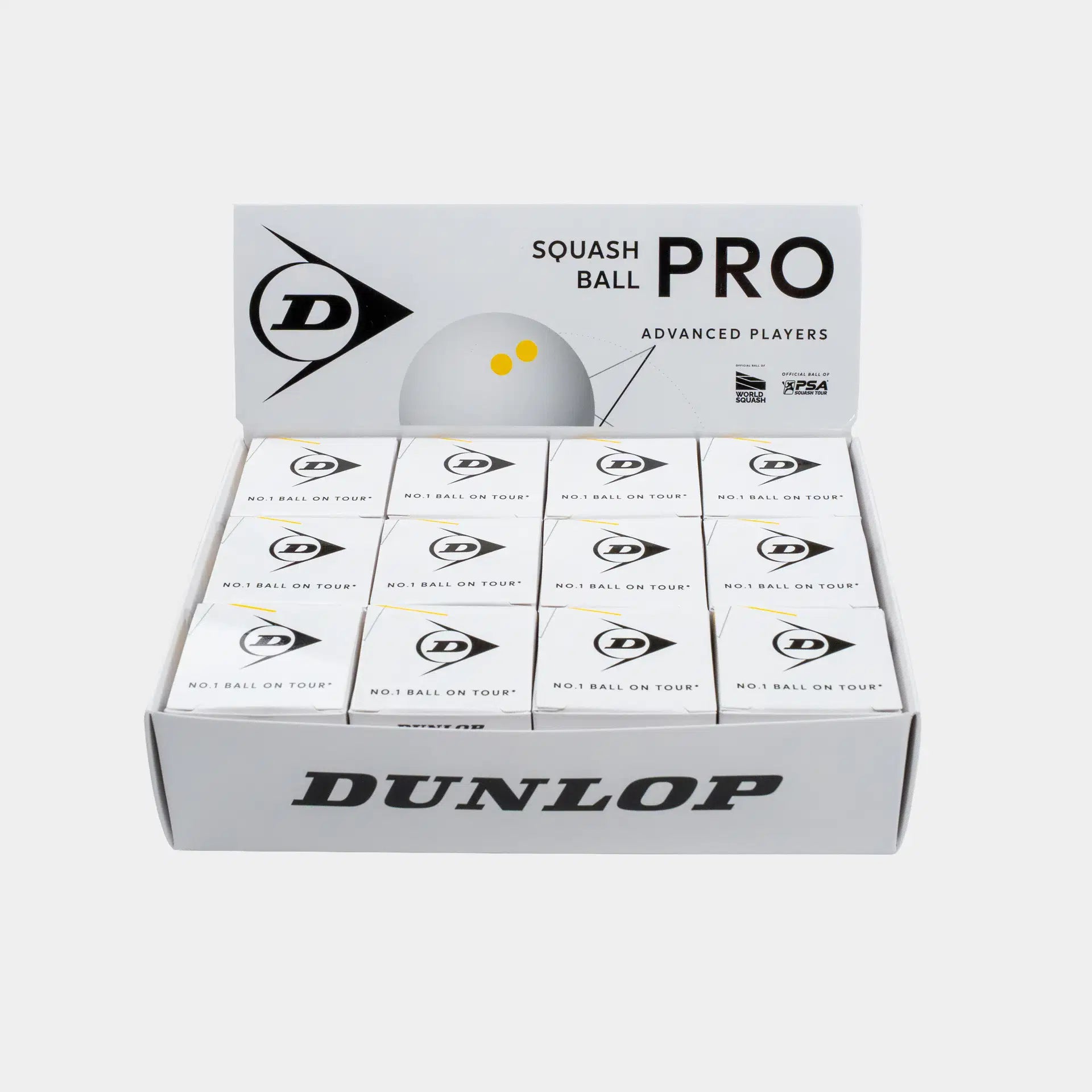 An open display box contains twelve individual Dunlop Pro White Squash Ball boxes, each labeled for advanced players and featuring the Dunlop logo along with “No.1 Ball on Tour!” text. This product is ideal as a low bounce squash ball, specifically designed for competitive play on glass courts.