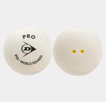 Two white squash balls from Dunlop’s Pro White Squash Ball (12 x 1 Ball Box) are shown. One features the Dunlop PRO PSA World Squash logo, while the other displays two small yellow dots, indicating it is a low bounce option. Both balls are placed against a plain white background, making them ideal for professional glass court play.