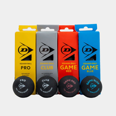The Dunlop Mixed Squash Ball Pack (4 x 3 Ball Box) by Dunlop features four types of squash balls displayed in front of their boxes: Pro (yellow box), Club (grey box), Game Red (red box), and Game Blue (blue box). This pack is ideal for players of varying skill levels, with each ball designed to suit a specific level.