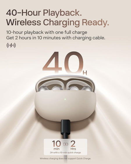 The Shokz OpenDots One by Shokz are beige open-ear earbuds in a charging case with a cable plugged in. Enjoy up to 40-hour playback, 10 hours per charge, and fast charging—2 hours of use after just 10 minutes. Immersive audio all day.