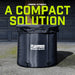 A black Urban Fitness Recovery Ice Bath by Urban Fitness sits on pavement outside a closed garage door. Above it, large green text reads "A COMPACT SOLUTION.
