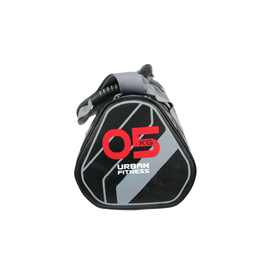 The Urban Fitness Power Bag by Urban Fitness features a black and gray design with bold red and white branding, weighs 05 KG, and is ideal for full-body conditioning. Shown against a white background.