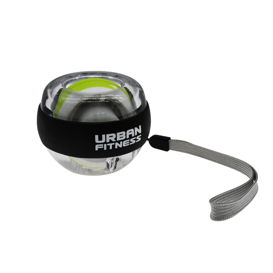 The Urban Fitness Wrist Exerciser Ball is a transparent plastic gyroscopic ball with a black Urban Fitness band, gray strap, and green-white inner mechanism. It helps boost grip strength and is ideal for injury prevention during workouts.