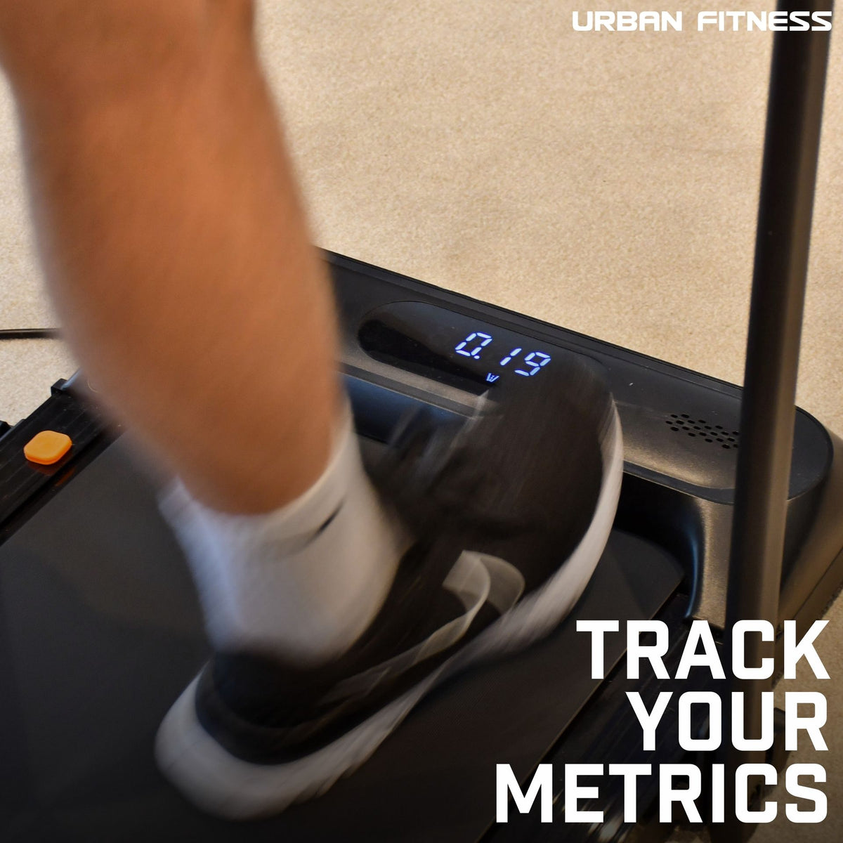 A person runs on the Urban Fitness Walking Treadmill, display showing 0.19. The Urban Fitness logo appears top right, with TRACK YOUR METRICS in bold white at bottom right, highlighting smart fitness tracking.